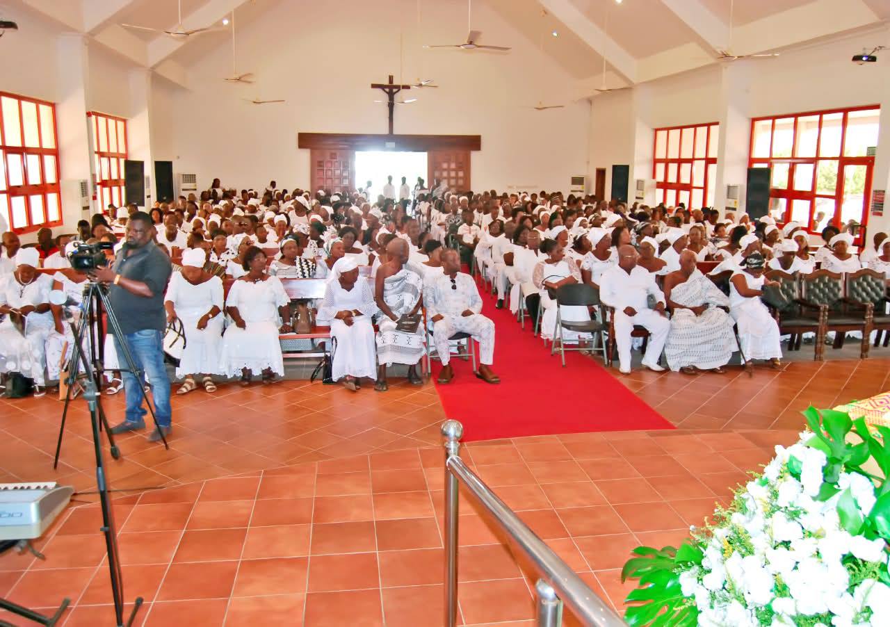 Chapel sanctuary congregation gathered in ceremonial white thanksgiving attire